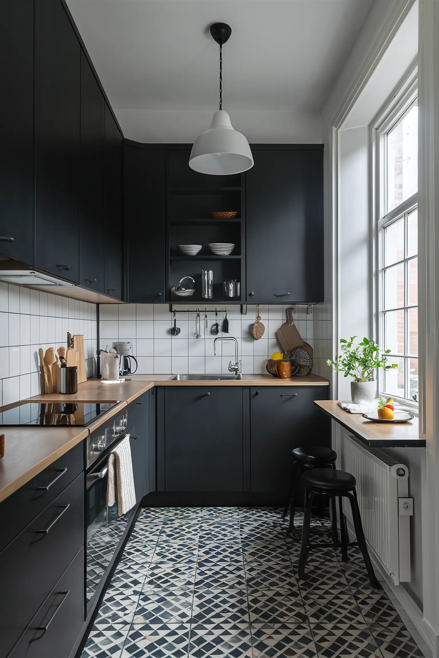 Small black kitchen with space-saving solutions and smart storage.