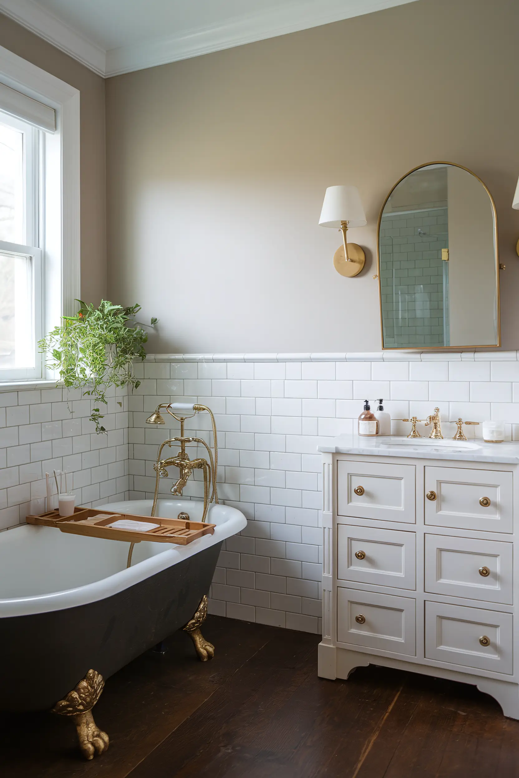 Timeless small luxury bathroom with classic elements like a clawfoot tub and subway tiles.