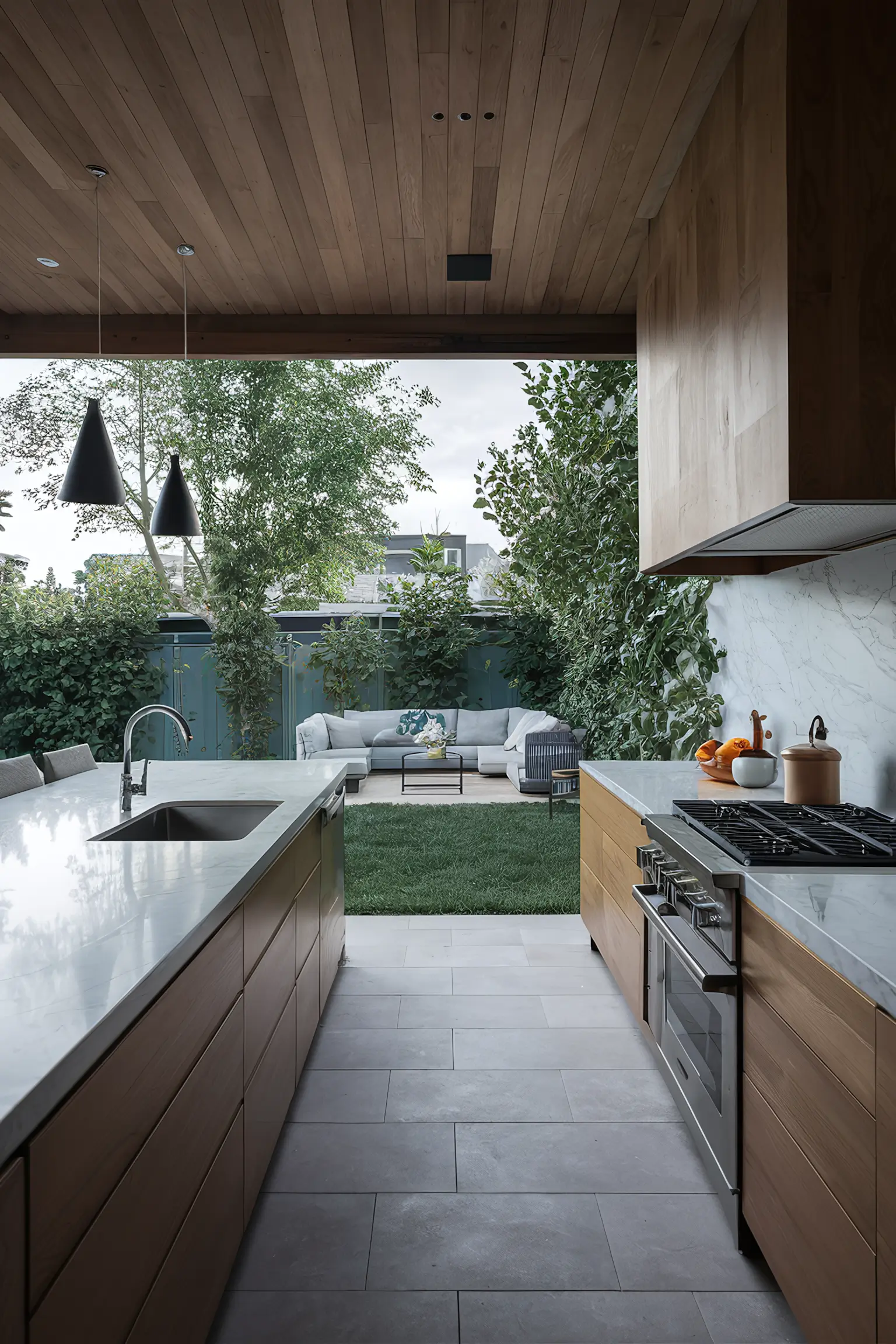 Backyard kitchen with sleek marble countertops.