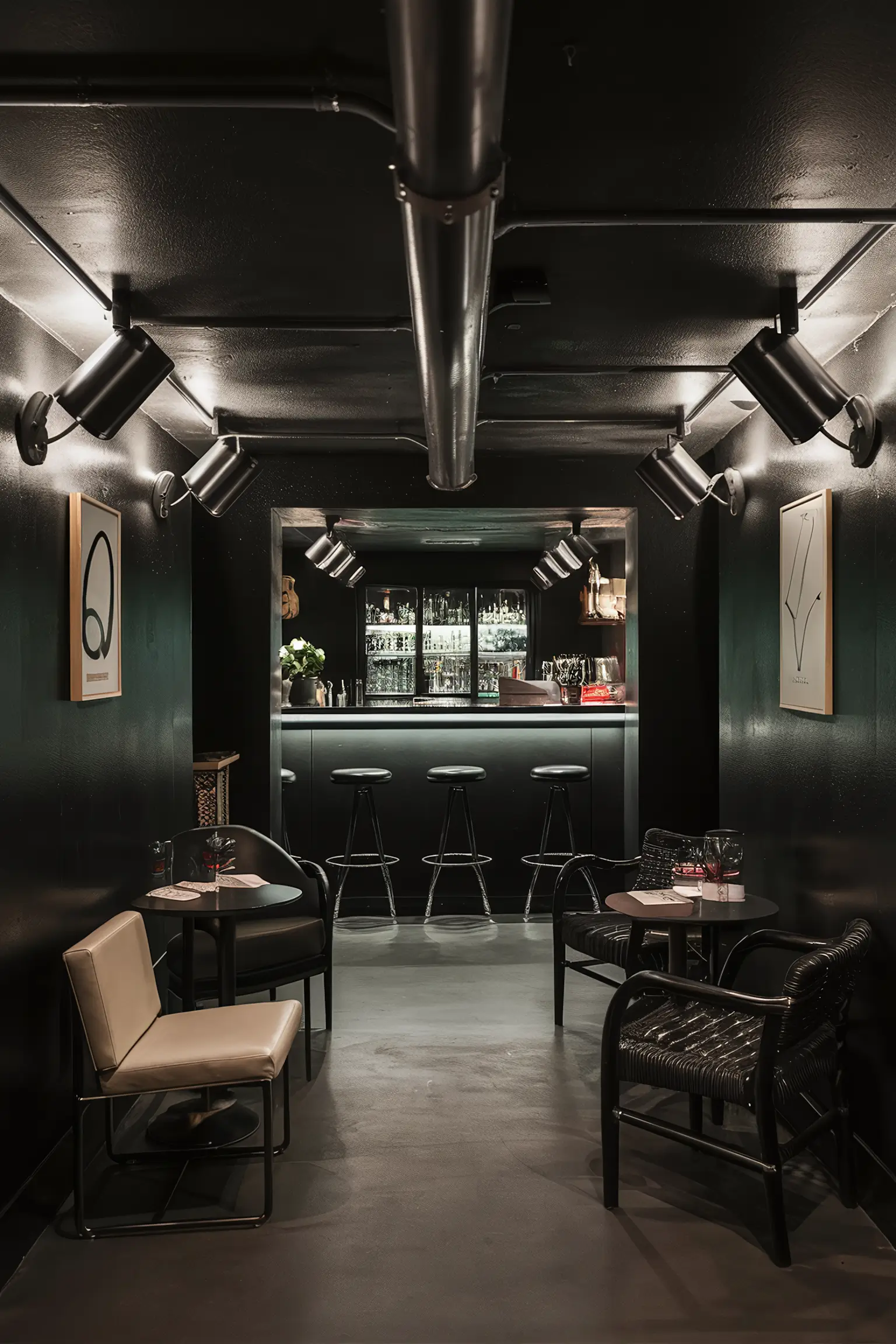 Sleek black basement bar with modern lighting and chic decor.